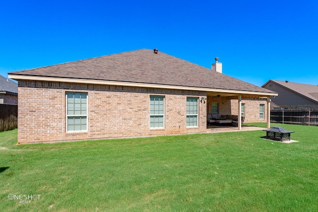 4549 Coyote Run, Abilene, TX 79602 - rear view of house with an outdoor living space with a fire pit, a chimney, roof with shingles, and brick siding