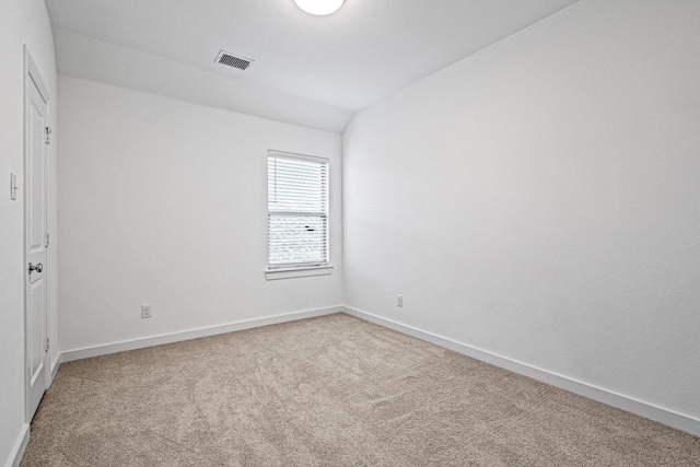 3952 Oak Creek Cir, Denison, TX 75020 - unfurnished bedroom with carpet flooring, vaulted ceiling, and baseboards