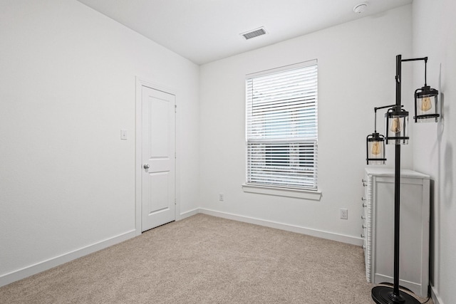 3952 Oak Creek Cir, Denison, TX 75020 - carpeted empty room featuring baseboards and a smoke detector