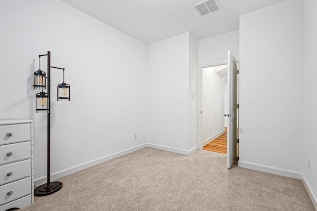 3952 Oak Creek Cir, Denison, TX 75020 - unfurnished bedroom featuring light colored carpet and baseboards