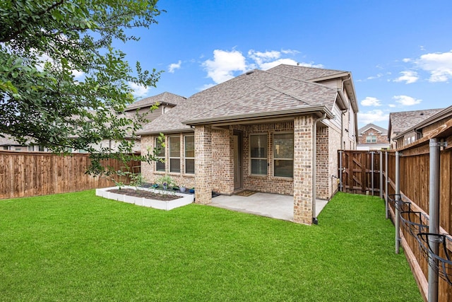 3952 Oak Creek Cir, Denison, TX 75020 - back of property with roof with shingles, brick siding, and a patio area