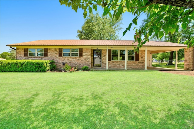 125 Harrison, Detroit, TX 75436 - ranch-style home featuring a front yard, an attached carport, and brick siding
