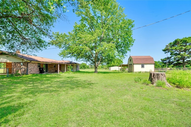 125 Harrison, Detroit, TX 75436 - view of yard with an outbuilding