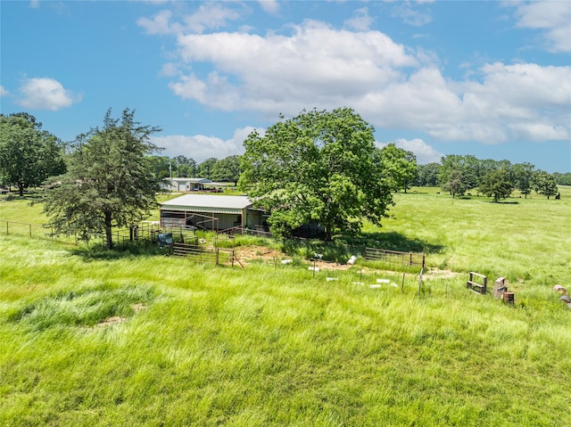 125 Harrison, Detroit, TX 75436 - view of yard with a view of countryside, an outbuilding, an exterior structure, and fence