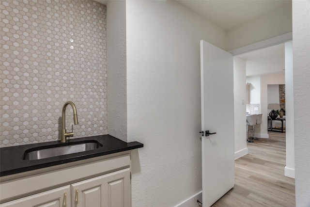 375 Briarwood Ln, Aledo, TX 76008 - bar area with a sink, light wood-type flooring, and baseboards