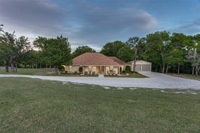 375 Briarwood Ln, Aledo, TX 76008 - view of front of house with covered porch, an outbuilding, a front lawn, gravel driveway, and a garage