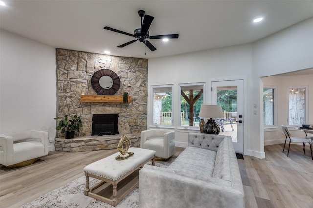 375 Briarwood Ln, Aledo, TX 76008 - living room featuring wood finished floors, baseboards, a fireplace, a ceiling fan, and recessed lighting