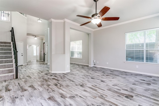 7711 Heather Ridge Ct, Irving, TX 75063 - unfurnished living room with ceiling fan, stairway, light wood-style flooring, ornamental molding, and baseboards