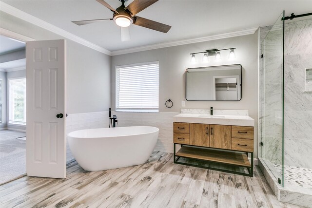7711 Heather Ridge Ct, Irving, TX 75063 - full bath with a marble finish shower, a ceiling fan, a freestanding tub, vanity, and ornamental molding