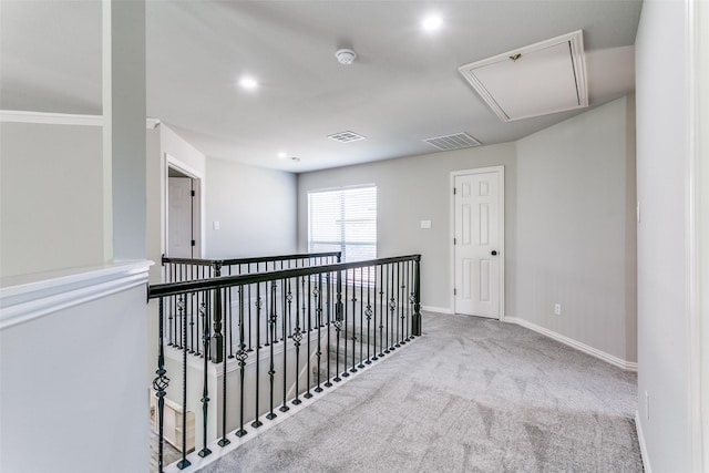 7711 Heather Ridge Ct, Irving, TX 75063 - hallway featuring attic access, carpet flooring, baseboards, recessed lighting, and an upstairs landing