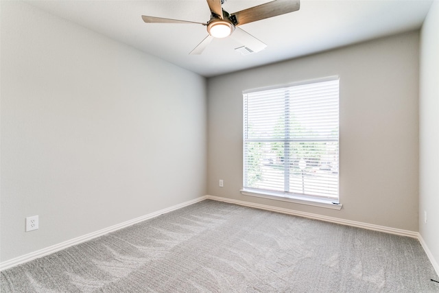 7711 Heather Ridge Ct, Irving, TX 75063 - carpeted spare room with baseboards and a ceiling fan