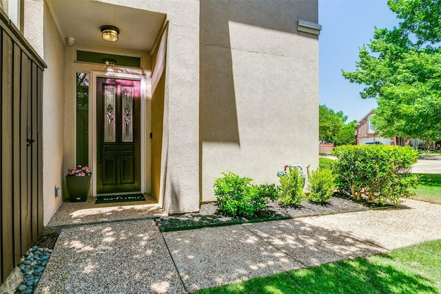 7711 Heather Ridge Ct, Irving, TX 75063 - view of exterior entry with stucco siding