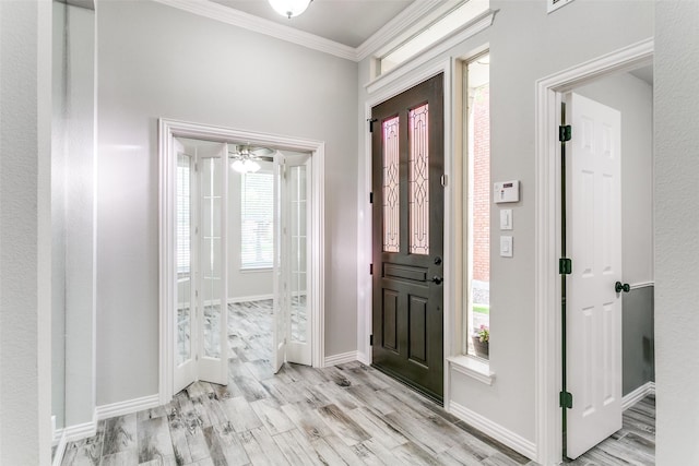 7711 Heather Ridge Ct, Irving, TX 75063 - entrance foyer with ornamental molding, light wood-style flooring, and baseboards