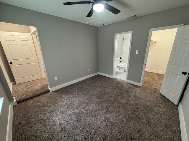 6832 Brierfield Cir, Dallas, TX 75232 - unfurnished bedroom with a walk in closet, dark carpet, baseboards, and ensuite bathroom