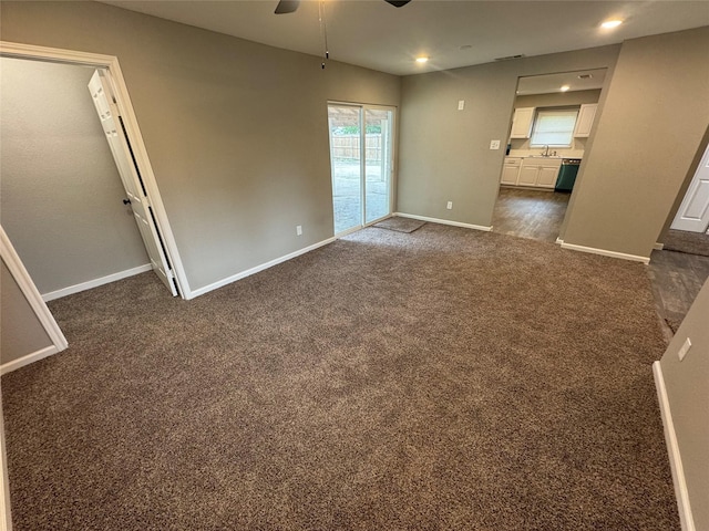 6832 Brierfield Cir, Dallas, TX 75232 - empty room featuring a ceiling fan, dark colored carpet, baseboards, a sink, and recessed lighting