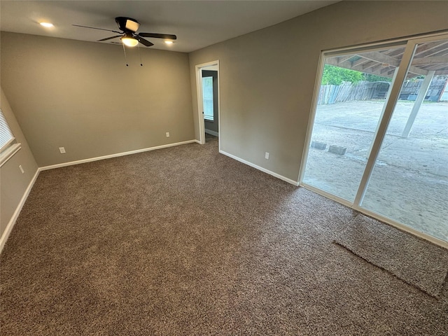 6832 Brierfield Cir, Dallas, TX 75232 - spare room featuring baseboards, ceiling fan, and dark colored carpet