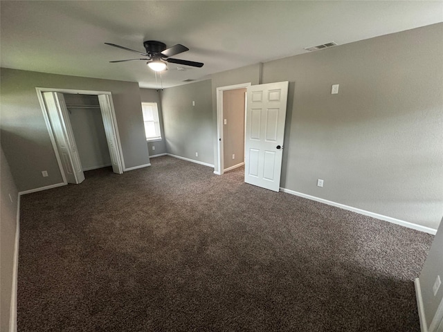 6832 Brierfield Cir, Dallas, TX 75232 - unfurnished bedroom featuring baseboards, dark carpet, ceiling fan, and a closet