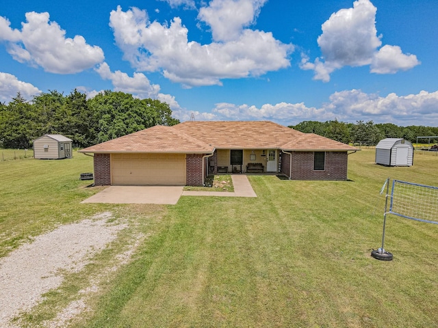 7662 Vz County Road 3504, Wills Point, TX 75169 - single story home with a storage unit, driveway, brick siding, and a garage