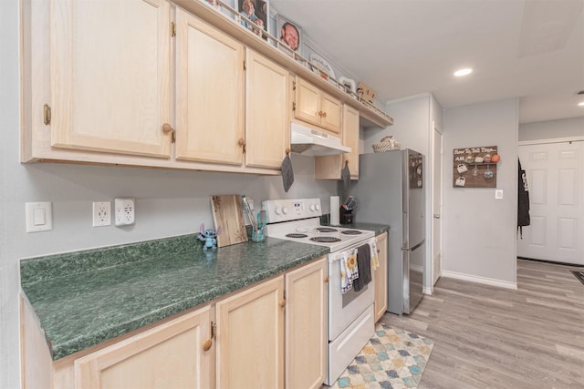 7662 Vz County Road 3504, Wills Point, TX 75169 - kitchen with white range with electric cooktop, under cabinet range hood, dark countertops, light brown cabinetry, and recessed lighting