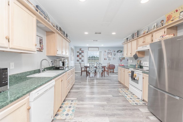 7662 Vz County Road 3504, Wills Point, TX 75169 - kitchen with white appliances, a sink, under cabinet range hood, recessed lighting, and light brown cabinets