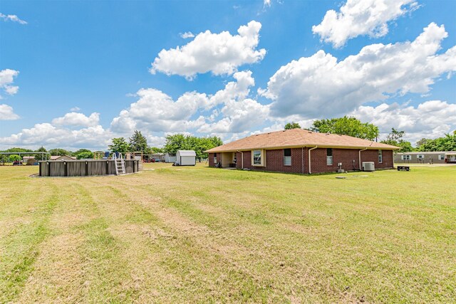 7662 Vz County Road 3504, Wills Point, TX 75169 - view of grassy yard with cooling unit, a storage shed, and an outdoor structure