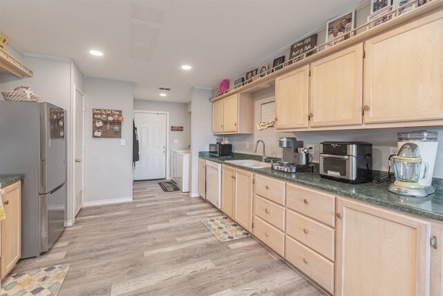 7662 Vz County Road 3504, Wills Point, TX 75169 - kitchen featuring light brown cabinetry, appliances with stainless steel finishes, a sink, light wood-type flooring, and dark countertops