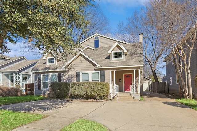 4532 Calmont Ave, Fort Worth, TX 76107 - view of front of property featuring a chimney, an outbuilding, and driveway