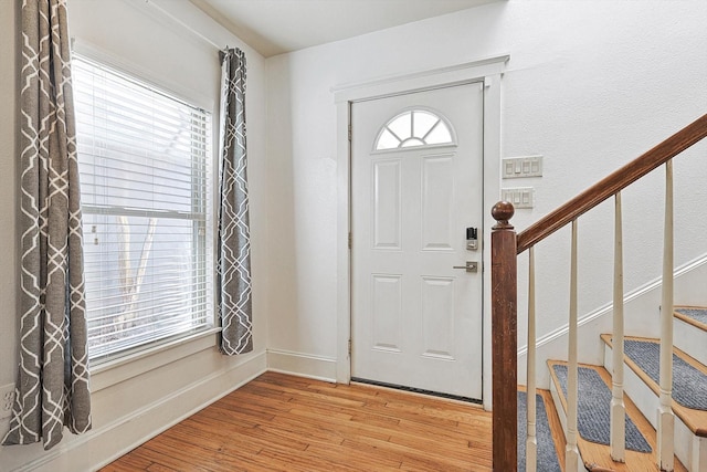 4532 Calmont Ave, Fort Worth, TX 76107 - entryway with light wood finished floors, stairs, and baseboards