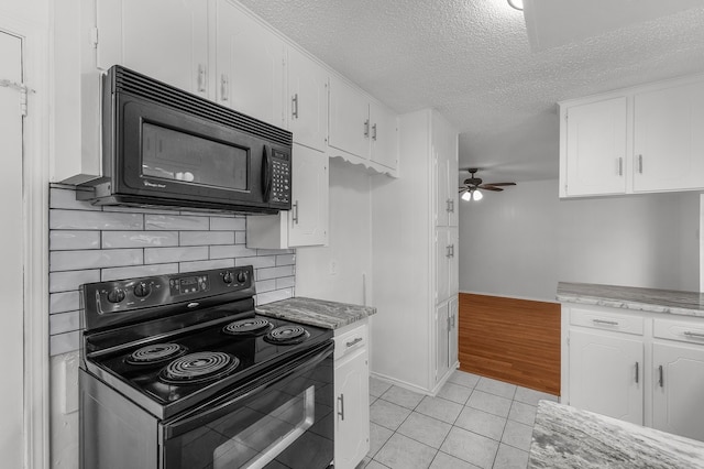 6032 Highcrest Dr, Watauga, TX 76148 - kitchen featuring black appliances, a textured ceiling, ceiling fan, white cabinets, and light tile patterned flooring