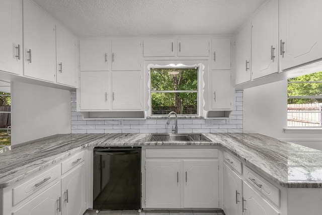 6032 Highcrest Dr, Watauga, TX 76148 - kitchen featuring a sink, dishwasher, white cabinets, a textured ceiling, and a peninsula