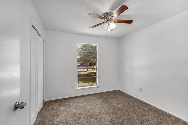 6032 Highcrest Dr, Watauga, TX 76148 - unfurnished bedroom with a textured ceiling, carpet, a closet, and baseboards