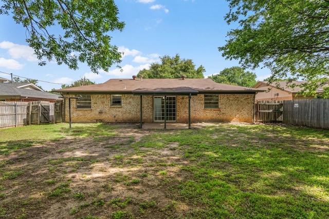 6032 Highcrest Dr, Watauga, TX 76148 - back of property featuring brick siding and a patio area