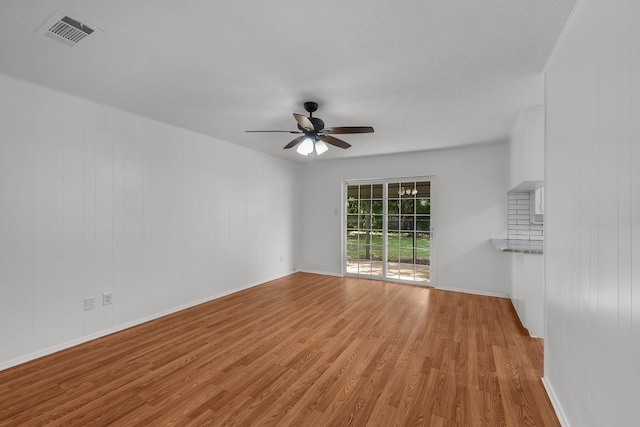 6032 Highcrest Dr, Watauga, TX 76148 - spare room featuring light wood-style floors, a ceiling fan, and baseboards