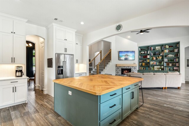 5900 Stage Coach Cir, Westlake, TX 76262 - kitchen with high quality fridge, arched walkways, butcher block countertops, white cabinetry, and recessed lighting