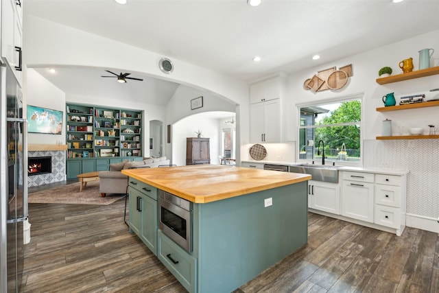 5900 Stage Coach Cir, Westlake, TX 76262 - kitchen featuring a sink, wooden counters, stainless steel microwave, white cabinets, and recessed lighting
