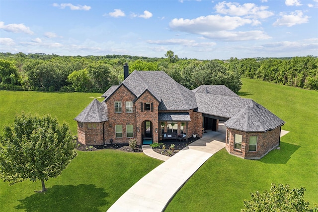 5900 Stage Coach Cir, Westlake, TX 76262 - view of front of house featuring a chimney, a front yard, and concrete driveway