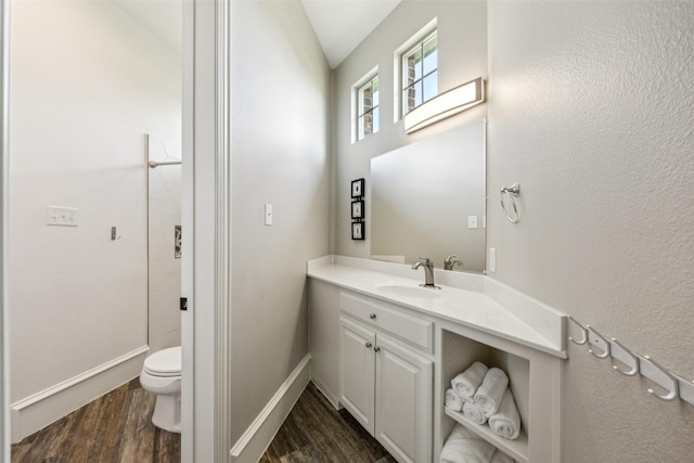 5900 Stage Coach Cir, Westlake, TX 76262 - bathroom featuring toilet, vanity, wood finished floors, baseboards, and a shower
