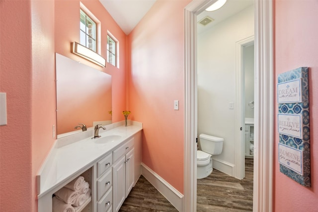 5900 Stage Coach Cir, Westlake, TX 76262 - bathroom featuring wood finished floors, toilet, vanity, and baseboards