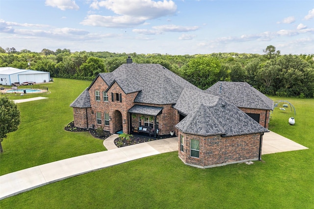 5900 Stage Coach Cir, Westlake, TX 76262 - view of front facade featuring brick siding, driveway, and a front yard