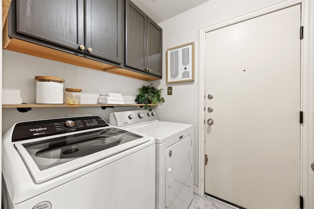 2441 Deerwood Dr, Little Elm, TX 75068 - clothes washing area with washer and clothes dryer, cabinet space, and light marble finish floors