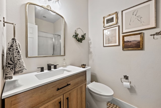 2441 Deerwood Dr, Little Elm, TX 75068 - bathroom with toilet, vanity, and a shower
