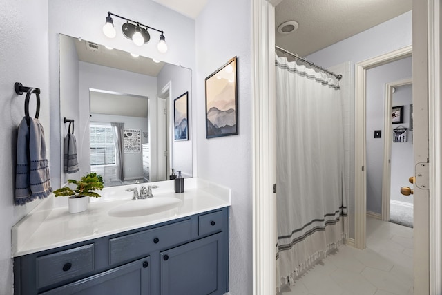 2441 Deerwood Dr, Little Elm, TX 75068 - full bath featuring vanity, tile patterned floors, and curtained shower