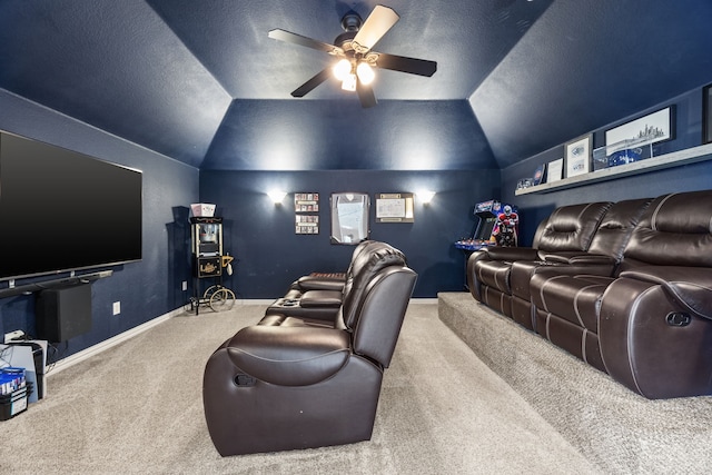 2441 Deerwood Dr, Little Elm, TX 75068 - carpeted home theater with ceiling fan, lofted ceiling, baseboards, and a textured ceiling