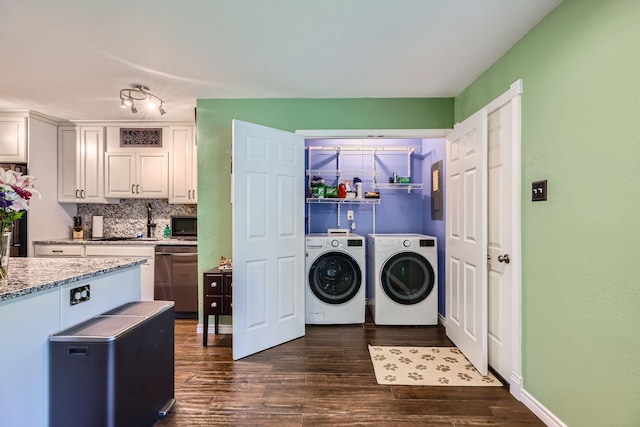 5225 Marks Cir, The Colony, TX 75056 - washroom with washer and clothes dryer, dark wood-type flooring, and baseboards