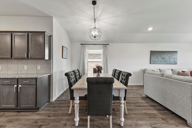 3303 Hawkins Dr, Fate, TX 75189 - dining space featuring a chandelier, dark wood-type flooring, and baseboards