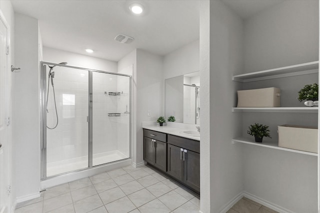 3303 Hawkins Dr, Fate, TX 75189 - full bath featuring a stall shower, tile patterned flooring, vanity, and recessed lighting