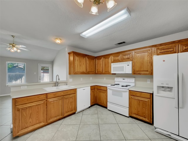 1301 Archdale Ct, Fort Worth, TX 76028 - kitchen with white appliances, a sink, a peninsula, ceiling fan, and brown cabinetry