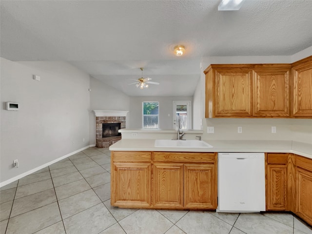 1301 Archdale Ct, Fort Worth, TX 76028 - kitchen with dishwasher, a sink, ceiling fan, a brick fireplace, and light countertops