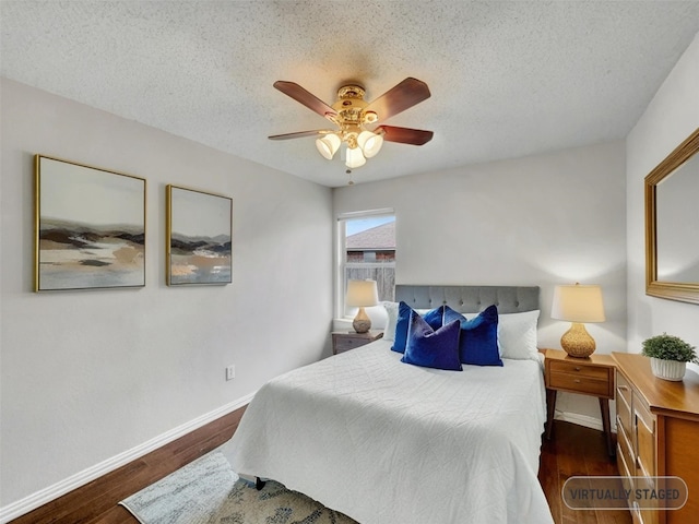 1301 Archdale Ct, Fort Worth, TX 76028 - bedroom with baseboards, wood finished floors, a textured ceiling, and a ceiling fan