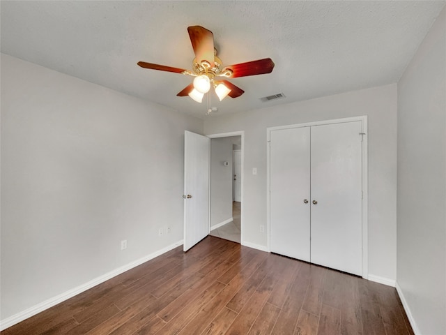 1301 Archdale Ct, Fort Worth, TX 76028 - unfurnished bedroom with wood finished floors, baseboards, and a closet